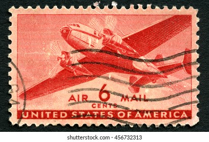 UNITED STATES OF AMERICA - CIRCA 1943: A Used US Air Mail Postage Stamp Depicting An Illustration Of A Vintage Transport Plane, Circa 1943.