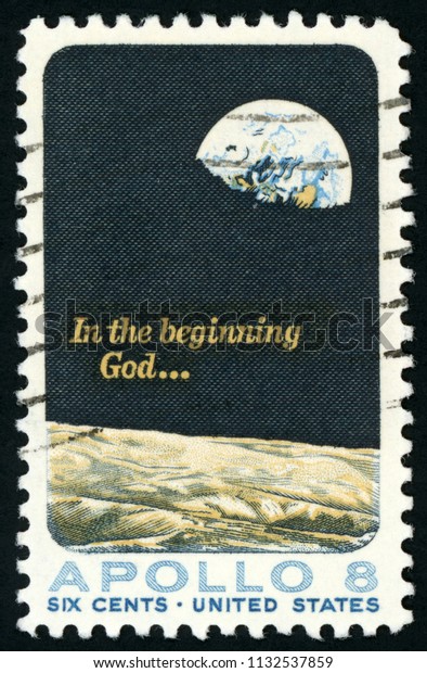 UNITED STATES OF AMERICA -\
CIRCA 1969: stamp printed in USA (US) shows Moon surface and Earth;\
Apollo 8 mission; in the beginning God; Scott 1371 A793 6c; circa\
1969