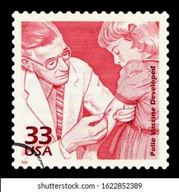 UNITED STATES OF AMERICA - CIRCA 1999: A Postage Stamp Printed In USA Showing An Image Of Doctor Injecting Polio Vaccine, Circa 1999.