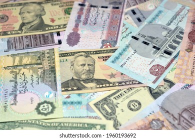 United States of America currency with Egyptian currency exchange rate, Selective focus of American dollars (50 dollars, 10 dollars and 1 dollar) with Egyptian pounds (50 pounds,10, 5 pounds, 1 pound)