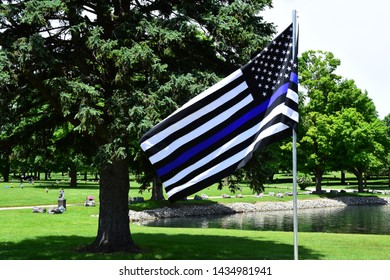 United States Of America Flag With Blue Stripes To Show Respect For Fallen Police Officer.