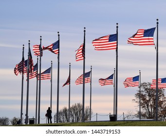 United States of America flags below the washington monument - Shutterstock ID 1443719153