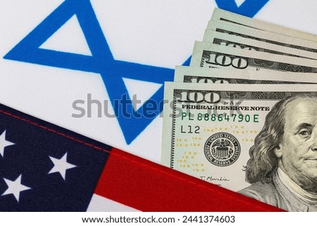 United States of America and Israel flags with cash money. Israel war financial support, foreign aid funding and military assistance concept.