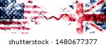 United States of America vs United Kingdom, British smoky mystic flags placed side by side. Thick colored silky abstract smokes banner of America and United Kingdom, British
