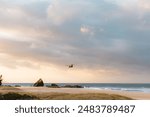 United States Army Blackhawk helicopter flying over Currumbin Beach towards Surfers Paradise on the Gold Coast