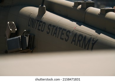 United States Army Logo Written Of A Military Helicopter Part Of The US Air Force. Military And Army Industry.