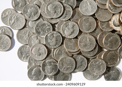 United States Bicentennial Quarters. A pile of 1776-1976 Quarters isolated on white. Unites States coin quarter dollar 1976, subject Bicentennial of Independence from England. Collectors Item. Quarter