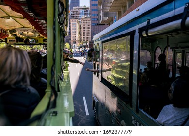 United States Boston 11 MAY 2018:  Cute Duck Boat Tour Guide Fist Bump Tour Guide On Another Tour Bus On The Street Of Boston City Centre.