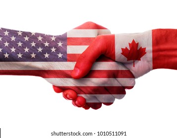 United States and Canada bilateral political relations and cooperation concept with USA and Canadian flags painted on handshake.