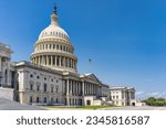 The United States Capitol building with American flag, Washington DC, USA.