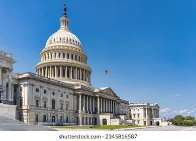 The United States Capitol building with American flag, Washington DC, USA.