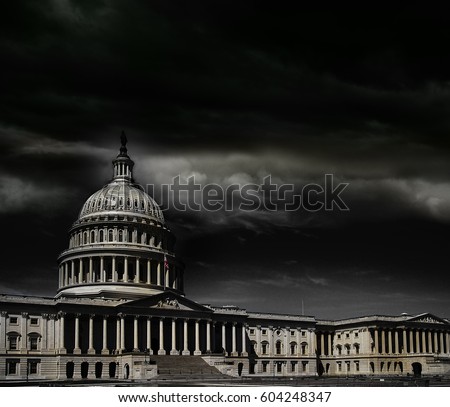 The United States capitol building with dark storm clouds above