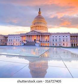 The United States Capitol Building With The Dome Lit Up At Night USA. 