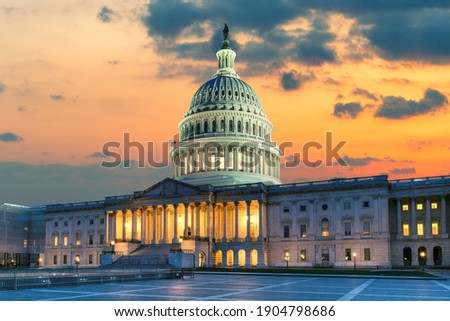 The United States Capitol Building at sunset in Washington DC, USA.
