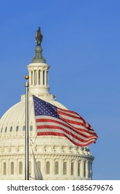 United States Capitol Building and US National flag - Washington DC, United States of America