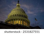 United States Capitol dome illuminated at sunset. Washington, D.C., USA