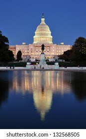 United States Capitol from the reflecting pool at dusk in Washington DC, USA.