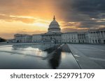 United States Capitol under a dramatic sky at sunset. Washington D.C., USA