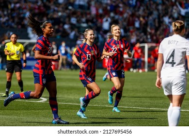 United States' Catarina Macario (20), Ashley Sanchez (13) and Kristie Mewis (22) celebrate their goal against the New Zealand during the She Believes Cup soccer match Feb. 20, 2022, in Carson, Calif.
