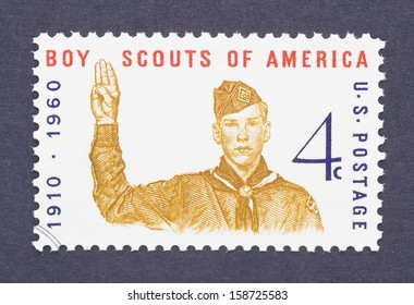 UNITED STATES - CIRCA 1960: A Postage Stamp Printed In USA Showing An Image Of Boy Scout Giving The Scout Sign And Commemorative Of The 50th Anniversary Of Boy Scouts America, Circa 1960. 