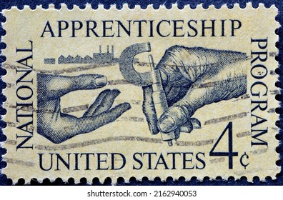 UNITED STATES - CIRCA 1962: A Postage Stamp From UNITED STATES , Showing Ein Machinist Handing Micrometer To Apprentice. Circa 1962