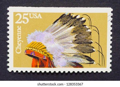 UNITED STATES Ã¢Â?Â? CIRCA 1990: A Postage Stamp Printed In USA Showing An Image Of An Indian Headdress Of The Cheyenne Tribe, Circa 1990.