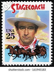 UNITED STATES - CIRCA 1990: A stamp printed by USA shows an image portrait of American actor John Wayne as The Ringo Kid in Stagecoach Western film, circa 1990.