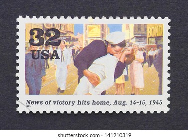 UNITED STATES - CIRCA 1995: A Postage Stamp Printed In USA Showing An Image Of A Marine Kissing A Girl Celebrating The End Of The Second World War, Circa 1995.