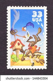 UNITED STATES - CIRCA 1998: A Postage Stamp Printed In United States Showing An Image Of Cartoon Characters The Road Runner And Wile E. Coyote, Circa 1998.