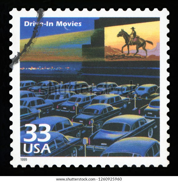 UNITED\
STATES -CIRCA 1999: A postage stamp printed in USA showing an image\
of a fifties drive-in movie theater, circa\
1999.