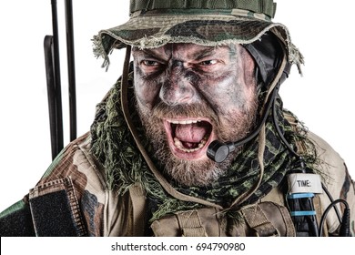 United States Commando face studio shot. Mouth opened, soldier yelling, emitting intiminate formidable frightening scream. Closeup portrait, cropped, isolated
