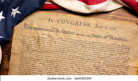 United States Declaration of Independence with a vintage American flag - Shutterstock ID 1669305349