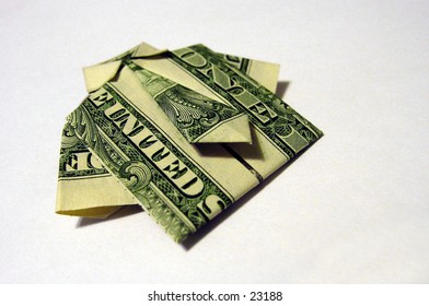 United States dollar bills folded origami style into a shirt and tie