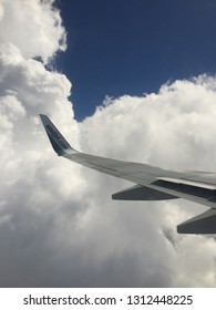 United States - February 02, 2019: West Jet Plane Wing On A Cloudy Day