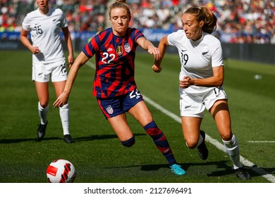United States' Kristie Mewis (22) and New Zealand's Elizabeth Anton (19) vie for the ball during the She Believes Cup soccer match Feb. 20, 2022, in Carson, Calif.
