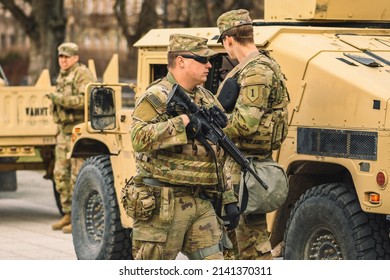 United States - March 29 2022: United States Marine Corps Soldiers With Weapons, Helmets And Armored Vehicles Humvee, USA Or US Army Troops Ready For Battle, Drills Or War In The City