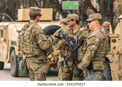 United States - March 29 2022: United States Marine Corps Soldiers With Weapons, Helmets And Armored Vehicles Humvee, USA Or US Army Troops Ready For Drills Or War In The City