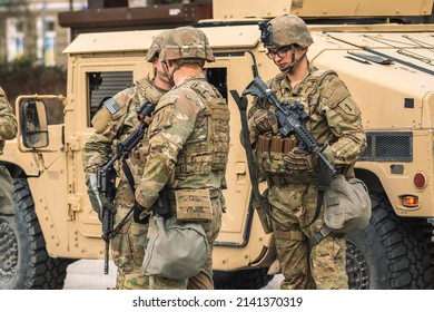 United States - March 29 2022: United States Marine Corps Soldiers With Weapons, Helmets And Armored Vehicle Humvee, USA Or US Army Troops Ready For Drills Or War In The City