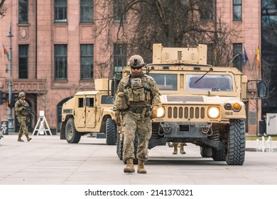 United States - March 29 2022: United States Marine Corps Soldiers With Weapons, Helmets And Armored Vehicles Humvee, USA Or US Army Troops Ready For Battle, Drills Or War Entering In The City