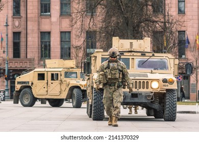 United States - March 29 2022: United States Marine Corps Soldiers With Weapons, Helmets And Armored Vehicles Humvee, USA Or US Army Troops Ready For Drills, Battle Or War Entering In The City