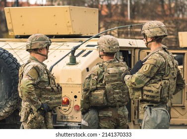 United States - March 29 2022: United States Marine Corps Soldiers With Weapons, Helmets And Armored Vehicle Humvee, USA Or US Army Troops Ready For Drills Or War In The City