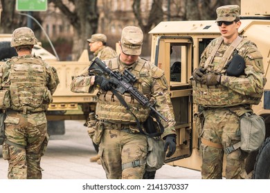 United States - March 29 2022: United States Marine Corps Soldiers With Shotguns Or Rifles, Helmets And Armored Vehicles Humvee, USA Or US Army Troops Ready For Battle, Drills Or War In The City