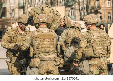 United States - March 29 2022: United States Marine Corps Soldiers With Weapons, Helmets And Armored Vehicle Humvee, USA Or US Army Troops Ready For Battle Drills Or War In The City