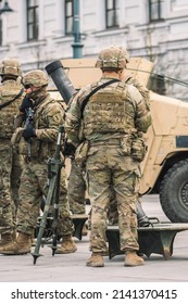 United States - March 29 2022: United States Marine Corps Soldiers With Helmets And Shotguns Or Rifles Preparing A Mortar, USA Or US Army Troops Ready For Drills Or War In The City, Vertical