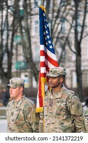 United States - March 29 2022: United States Marine Corps Soldiers With American Flag During A Ceremony, USA Or US Army Troops Ready For Drills Or War, Vertical