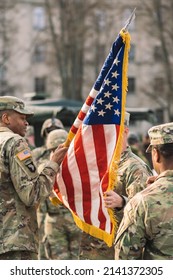 United States - March 29 2022: United States Marine Corps Soldiers Roll Up American Flag During A Ceremony, USA Or US Army Troops Ready For Drills, Battle Or War With Patch On The Uniform, Vertical