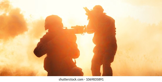 United States Marines In Action. Military Equipment, Army Helmet, Warpaint, Smoked Dirty Face, Tactical Gloves. Military Action, Desert Battlefield, Smoke Grenades