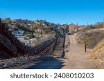 United States Mexico Border Wall between Nogales Arizona and Nogales Sonora on International Street in city of Nogales, Arizona AZ, USA. 