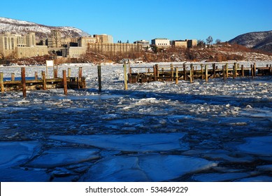 The United States Military Academy At West Point Winter Rises Over A Frozen Hudson River