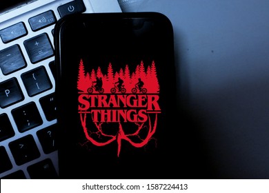 United States, New York. Sunday, September 29, 2019.Computer keyboard with the Iphone 11 pro with the Stranger Things logo. Stranger Things is an American web series of suspense and science fiction.